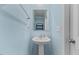 Bathroom featuring a pedestal sink and light blue walls at 1004 Bridgewater Dr, Durham, NC 27704