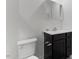 Modern bathroom features a vanity with modern fixtures and storage, with a commode at 1004 Bridgewater Dr, Durham, NC 27704
