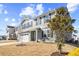Charming two-story home featuring a classic gray facade, attached two-car garage, and partially landscaped front yard at 1004 Bridgewater Dr, Durham, NC 27704
