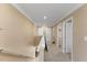 Upstairs hallway with neutral carpet features white doors, trim and baseboards to complement the freshly painted walls at 1004 Bridgewater Dr, Durham, NC 27704