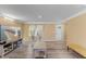 Comfortable living room features hardwood floors and is brightly lit by natural light through large windows at 1004 Bridgewater Dr, Durham, NC 27704
