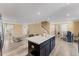 Open-concept living room with kitchen island and dining area at 1004 Bridgewater Dr, Durham, NC 27704