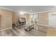 Comfortable living room features hardwood floors and is brightly lit by natural light through large windows at 1004 Bridgewater Dr, Durham, NC 27704