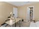 The bright home office features a comfortable seating arrangement and desk at 1004 Bridgewater Dr, Durham, NC 27704