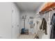 A simple yet organized walk-in closet with wire shelving provides ample storage for clothing, towels, and other items at 1004 Bridgewater Dr, Durham, NC 27704
