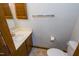 Powder room with wood trim and fixtures at 1004 Hempstede Dr, Zebulon, NC 27597