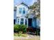 Charming front exterior of the home with bay windows and well-maintained landscaping at 1004 Hempstede Dr, Zebulon, NC 27597
