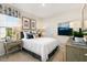 Comfortable bedroom with plenty of natural light, decorated with stylish lamps and wall art at 1008 Octans Way, Wendell, NC 27591
