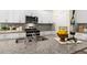 Kitchen island with granite countertops, stainless steel sink, and elegant white cabinetry at 1008 Octans Way, Wendell, NC 27591