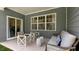 Covered patio with comfortable seating and ample space for outdoor enjoyment at 1008 Octans Way, Wendell, NC 27591