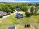 Aerial view of a home with large lot and landscaped yard in a neighborhood with mature trees at 105 Pinecrest Dr, Angier, NC 27501