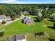 Aerial view of home in a lush green neighborhood, with a sprawling lawn and mature trees offering privacy at 105 Pinecrest Dr, Angier, NC 27501