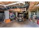 Unfinished basement area with exposed ceiling, cement block walls, storage items and riding lawn mower at 105 Pinecrest Dr, Angier, NC 27501