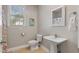 Full bathroom with vanity, window, toilet, and decorative shower curtain at 105 Pinecrest Dr, Angier, NC 27501