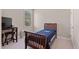 Bedroom with carpet, window, TV, desk, and bed with a blue blanket at 105 Pinecrest Dr, Angier, NC 27501