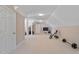 Bonus room with neutral carpet, exercise equipment, and a tv at 105 Pinecrest Dr, Angier, NC 27501