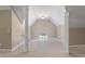 Bonus room with white columns, a window, and neutral carpet at 105 Pinecrest Dr, Angier, NC 27501