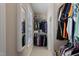 Walk-in closet with shelving and rods for clothing organization at 105 Pinecrest Dr, Angier, NC 27501