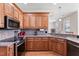 Elegant kitchen featuring stainless steel appliances, granite countertops, and abundant cabinetry at 105 Pinecrest Dr, Angier, NC 27501