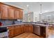 Spacious kitchen featuring granite countertops, stainless steel appliances, and wood cabinetry at 105 Pinecrest Dr, Angier, NC 27501