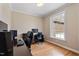 Bright home office features hardwood floors, crown molding, and large window for ample natural light at 105 Pinecrest Dr, Angier, NC 27501