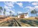 Large backyard featuring the home's rear exterior, screened porch, and privacy fence at 110 Lilac Dr, Franklinton, NC 27525