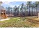 Expansive backyard with lush green grass, privacy fence, and a wooded backdrop at 110 Lilac Dr, Franklinton, NC 27525