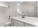 Bright bathroom featuring a shower-tub combo and a vanity with a large mirror at 110 Lilac Dr, Franklinton, NC 27525