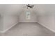 Spacious bonus room with neutral carpet, fan and lots of natural light from the window at 110 Lilac Dr, Franklinton, NC 27525
