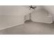 Bonus room with neutral carpet, ceiling fan, and plenty of space for activities at 110 Lilac Dr, Franklinton, NC 27525