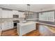 Modern kitchen featuring white cabinets, a gray subway tile backsplash, and stainless steel appliances at 110 Lilac Dr, Franklinton, NC 27525