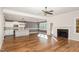 Open concept living space featuring hardwood floors, a fireplace, and an eat-in kitchen at 110 Lilac Dr, Franklinton, NC 27525