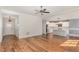 Open concept living room with hardwood floors flowing into the bright kitchen at 110 Lilac Dr, Franklinton, NC 27525