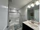 Modern bathroom with a glass door shower, neutral colors, and updated fixtures at 1113 Hudson Dr, Mebane, NC 27302