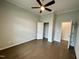 Spacious bedroom with ceiling fan, light gray walls, and carpet at 1113 Hudson Dr, Mebane, NC 27302