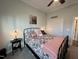 Cozy bedroom showcases a decorative bed with a comfortable pink throw and floral accents at 1113 Hudson Dr, Mebane, NC 27302