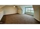 Spacious carpeted bedroom with natural light and a ceiling fan at 1113 Hudson Dr, Mebane, NC 27302