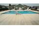Outdoor community pool with a safety railing and lounge chairs at 1113 Hudson Dr, Mebane, NC 27302
