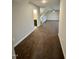Spacious upstairs hallway with a view of the bonus room and bathroom at 1113 Hudson Dr, Mebane, NC 27302