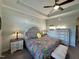 Bedroom offers large window, tray ceilings with crown molding, ceiling fan and beautiful decor at 1113 Hudson Dr, Mebane, NC 27302