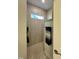 Modern bathroom shower featuring horizontally laid tile and a narrow window at 1113 Hudson Dr, Mebane, NC 27302