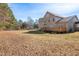 Expansive backyard featuring a spacious wooden deck perfect for outdoor entertaining and relaxation at 1175 Faulkner Town Rd, Henderson, NC 27537