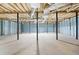 Spacious unfinished basement featuring support pillars and open ceiling at 1175 Faulkner Town Rd, Henderson, NC 27537