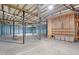 A concrete basement with exposed ceiling with insulation and duct work at 1175 Faulkner Town Rd, Henderson, NC 27537