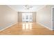 Bedroom with hardwood floors, a ceiling fan, and a bay window with plantation shutters at 1175 Faulkner Town Rd, Henderson, NC 27537