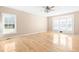 Bedroom featuring hardwood floors, a ceiling fan, and a bay window at 1175 Faulkner Town Rd, Henderson, NC 27537