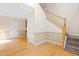 Bright entryway with hardwood floors, staircase, and neutral wall tones that create a welcoming ambiance at 1175 Faulkner Town Rd, Henderson, NC 27537