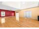 Bright living room featuring hardwood floors, high ceilings, and sliding glass doors to the outside at 1175 Faulkner Town Rd, Henderson, NC 27537