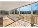 Covered porch view with wooden floor, white railings, and scenic view of surrounding trees at 1175 Faulkner Town Rd, Henderson, NC 27537