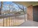 Cozy balcony offers a serene view of the landscaped grounds and neighboring buildings at 1287 Schaub Dr # J, Raleigh, NC 27606